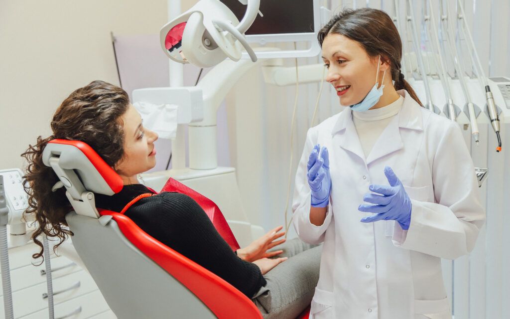 Dentist with Patient in Chair