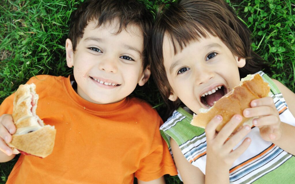 Two Chi;ldren with Healthy Lunches